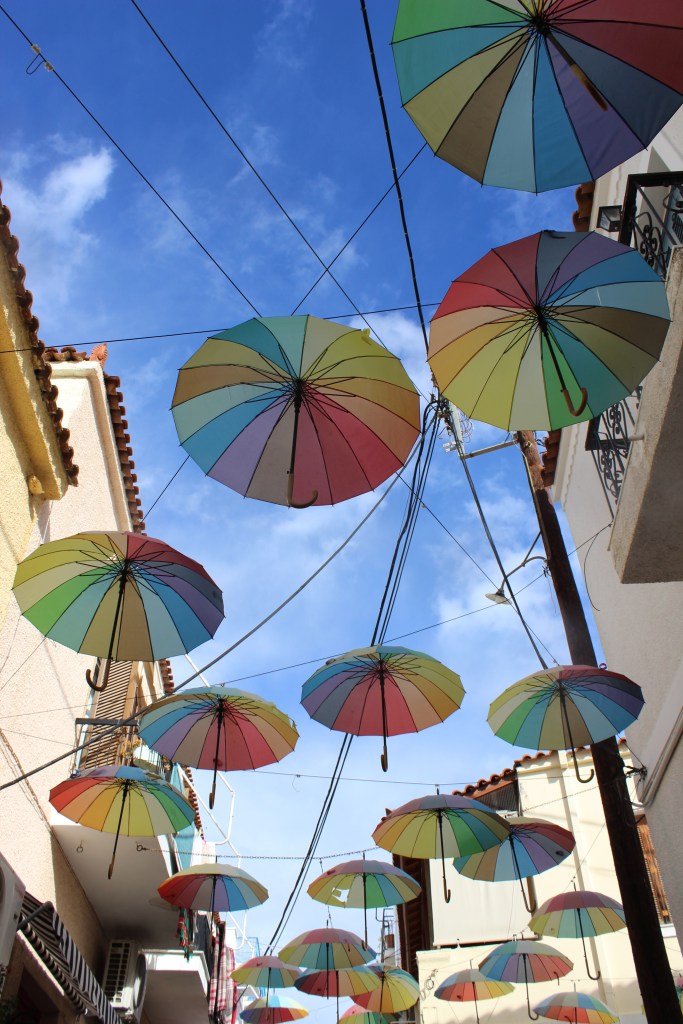 Colourful umbrellas hanging above the street